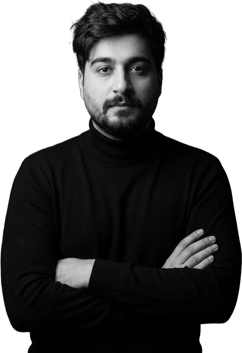 Aryan Moradi in a black turtleneck, arms crossed